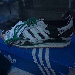 Adidas Camouflage Sneakers with Green Accents